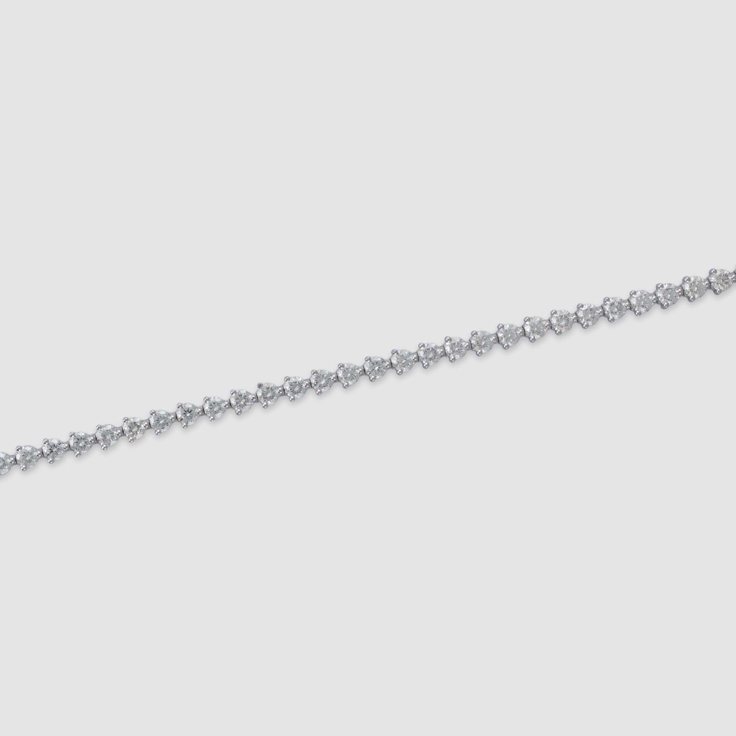 14K white gold three-prong diamond tennis bracelet