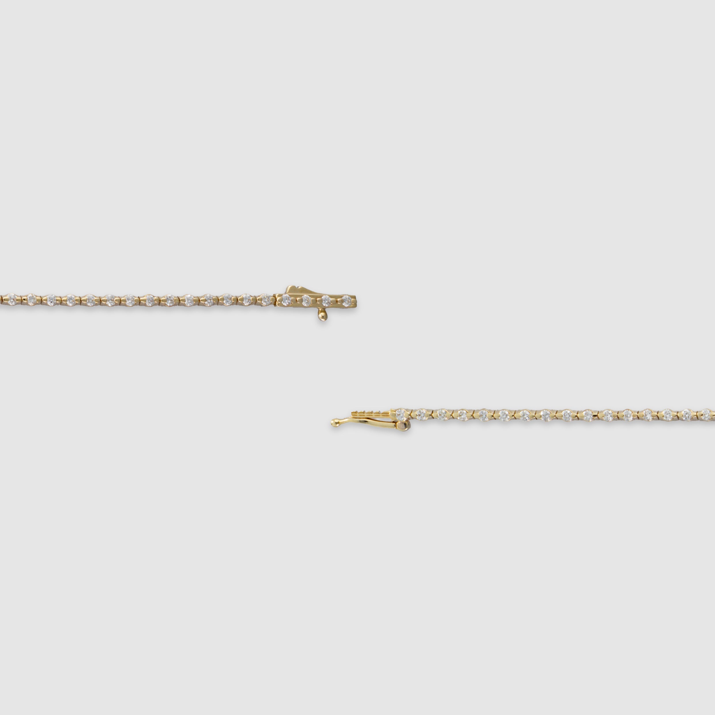 14K yellow gold round-cut diamond tennis bracelet in a bezel setting