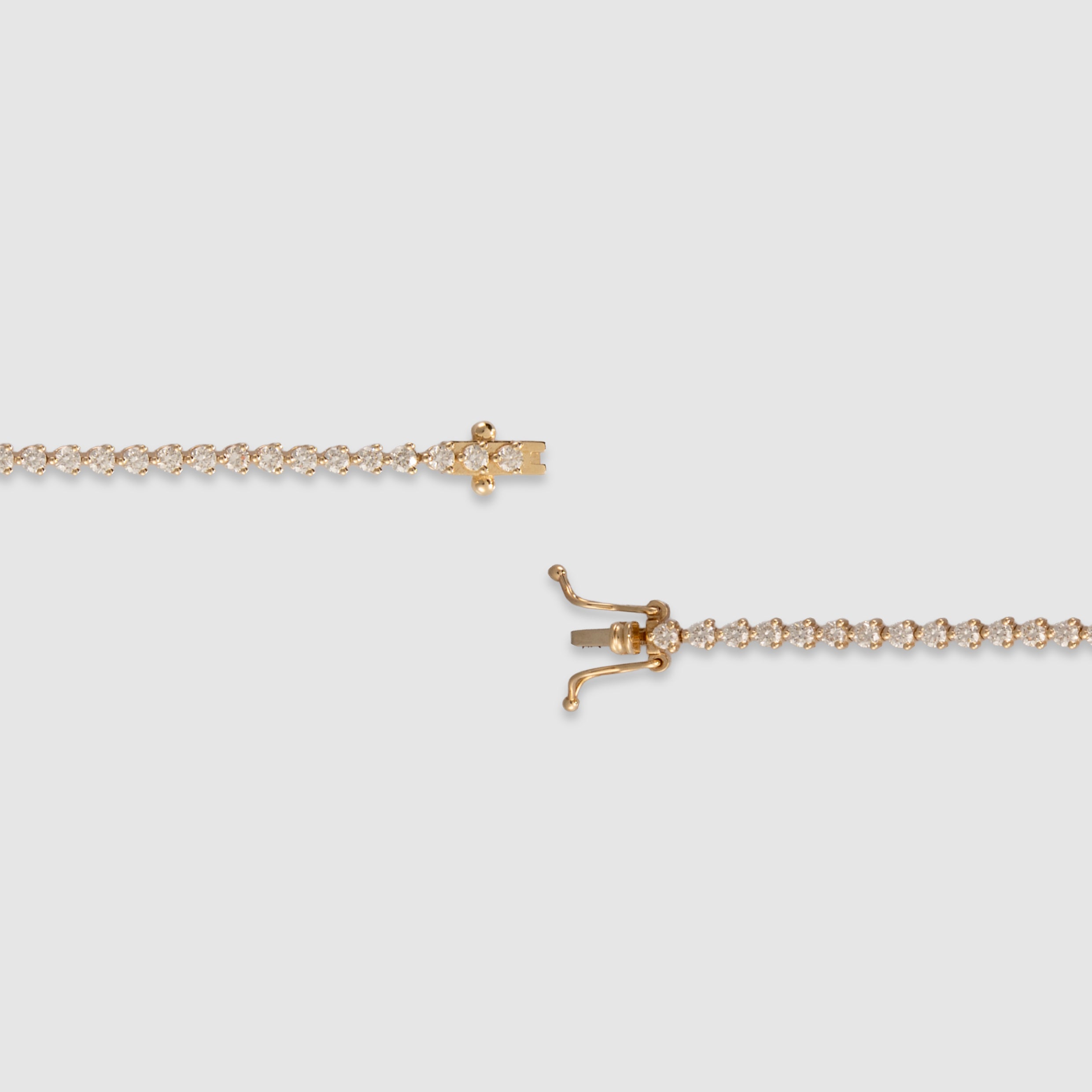 14K yellow gold three-prong diamond tennis bracelet