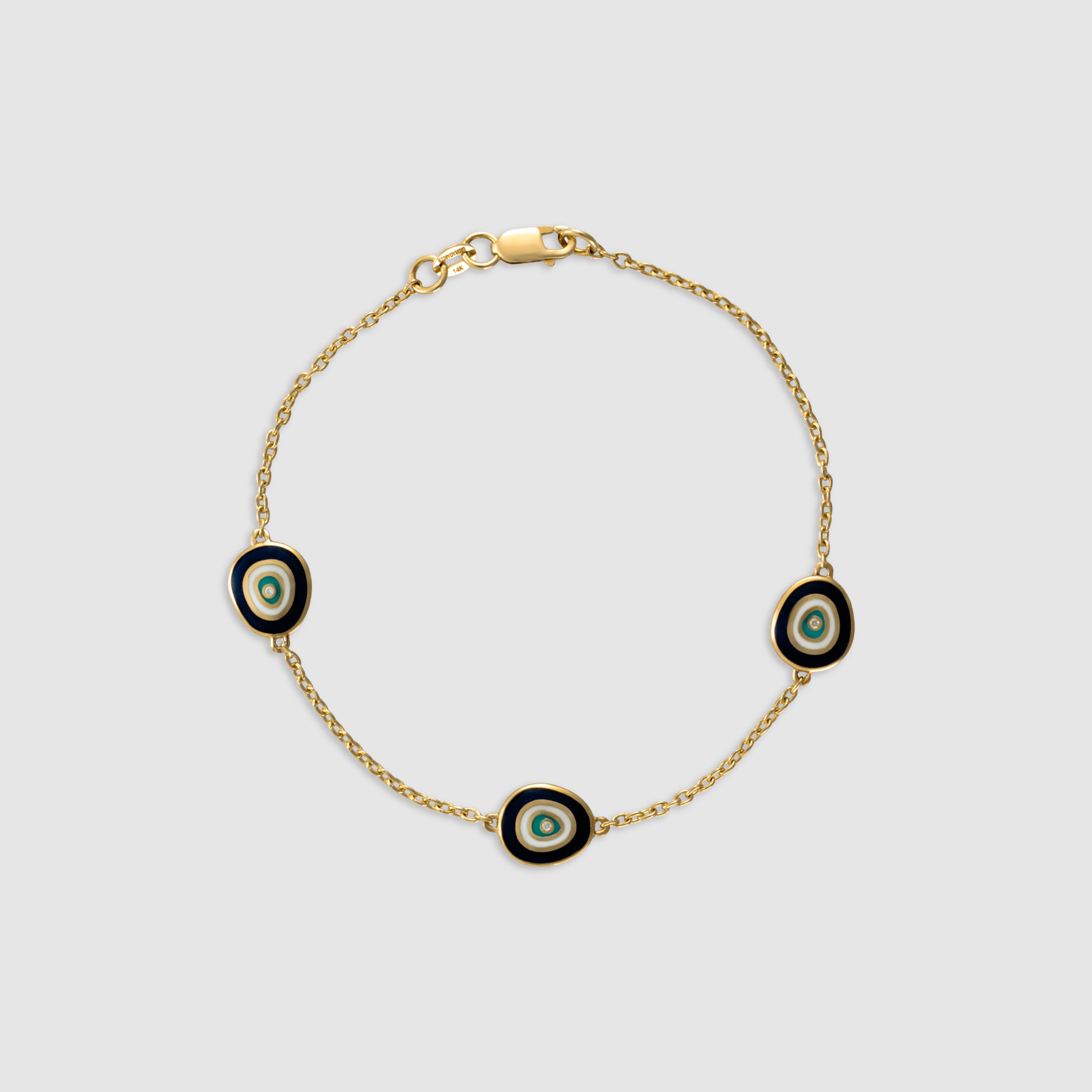 14K yellow gold bracelet with diamond evil eye charms