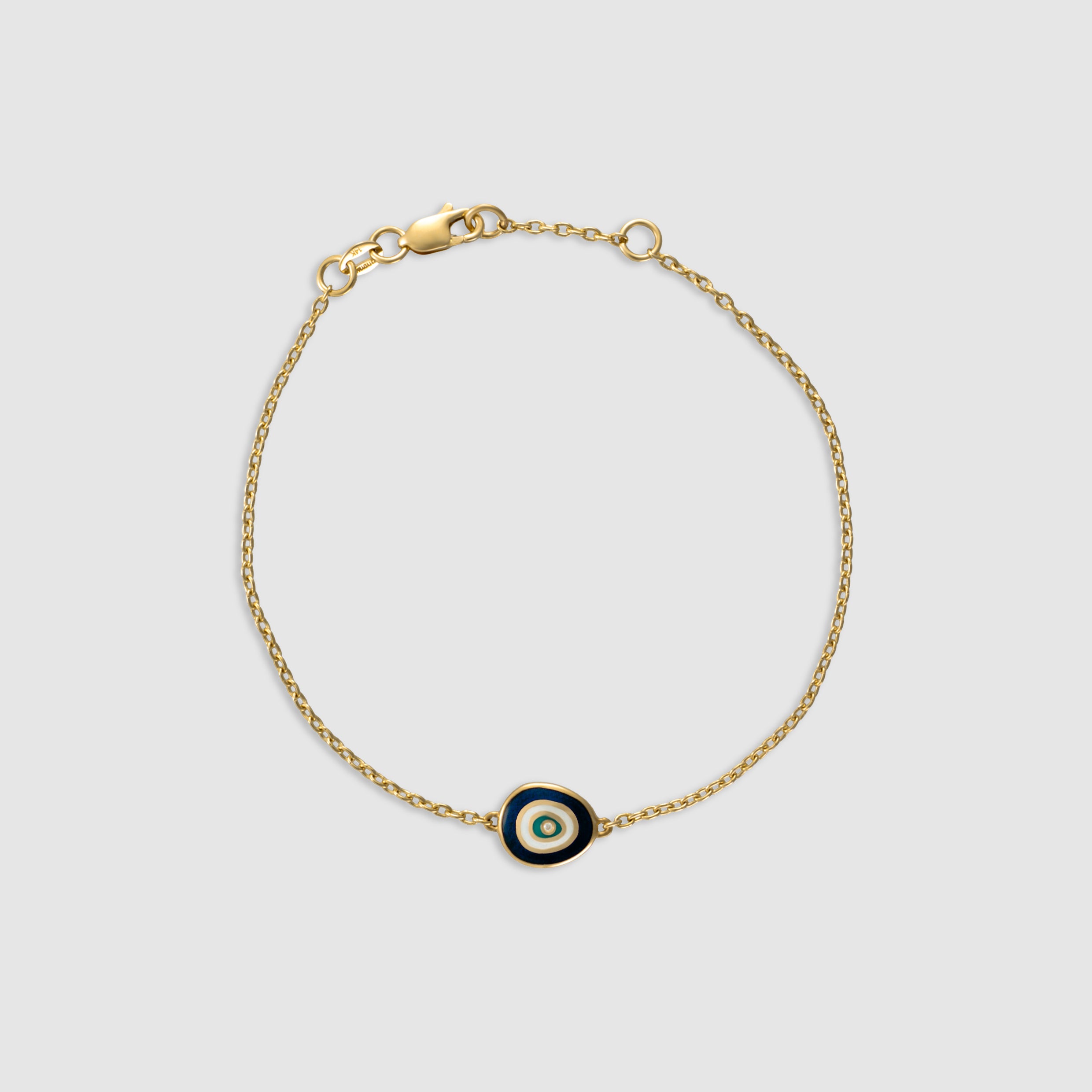 14K yellow gold bracelet with a diamond evil eye charm