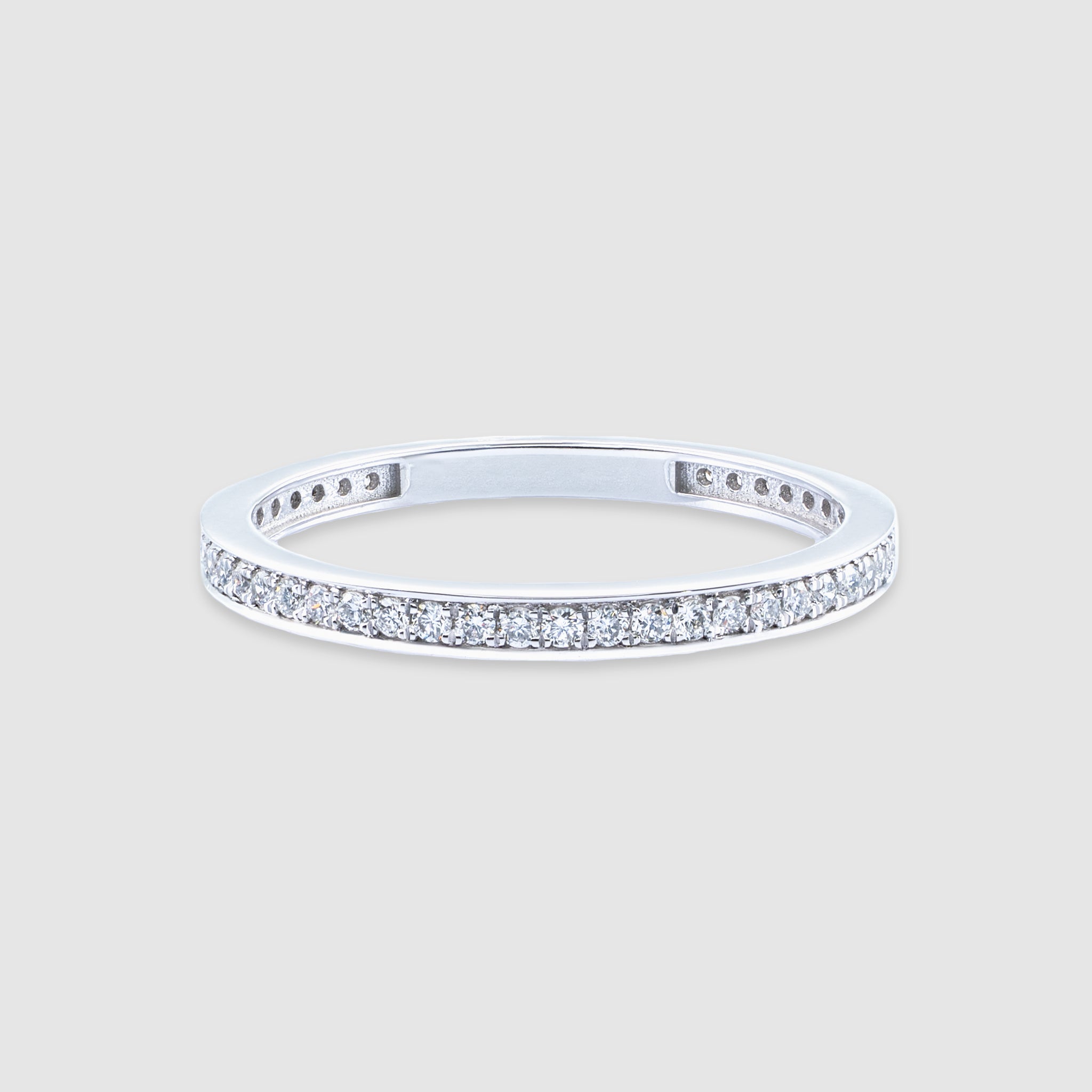 14K white gold round cut diamond eternity ring.