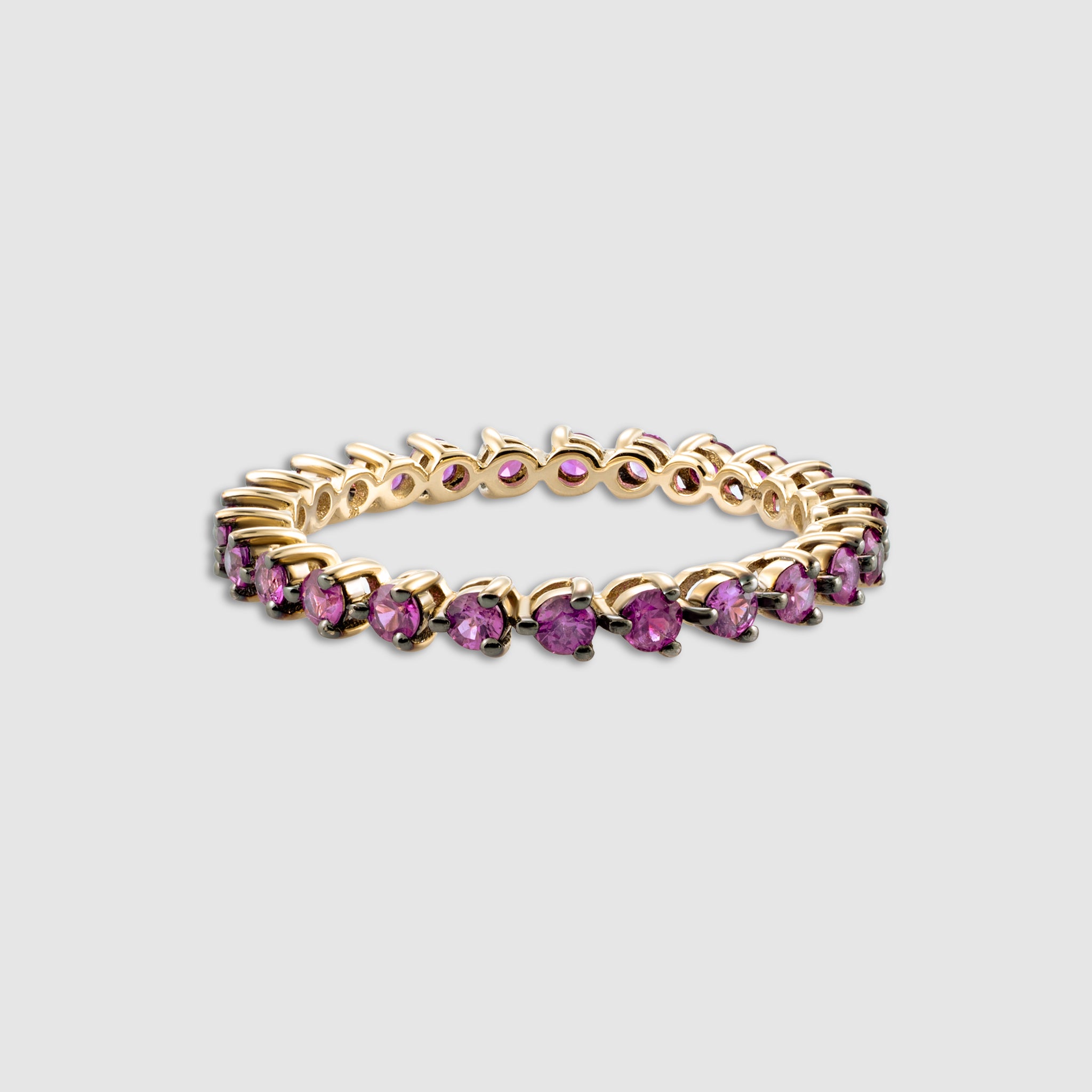 14K solid gold 3 prong round cut pink sapphire eternity ring.