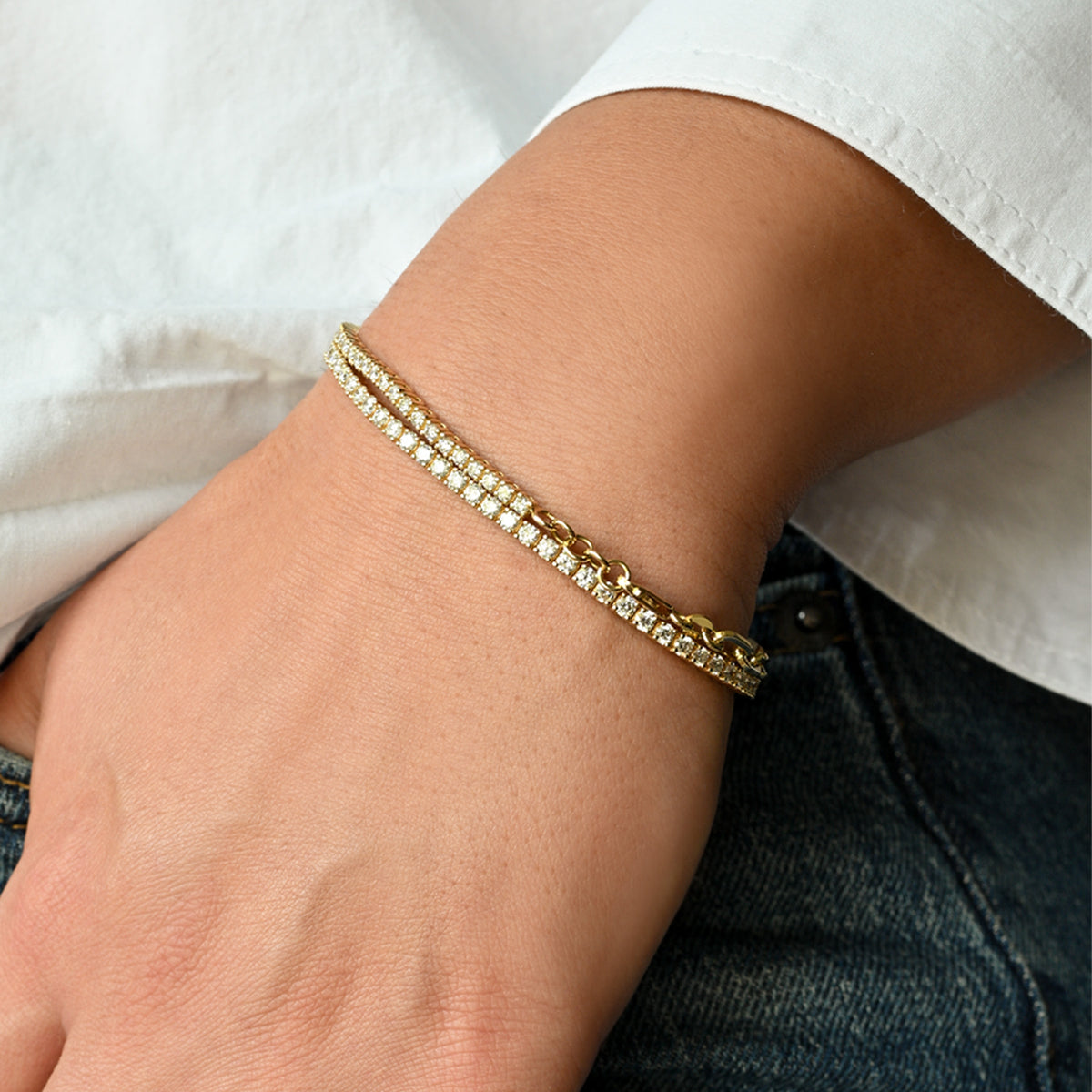 Riviera Diamond Tennis Bracelet in yellow gold, half natural diamonds and half paperclip chain, stacked with the Grand 4-Prong Diamond Tennis Bracelet on the wrist