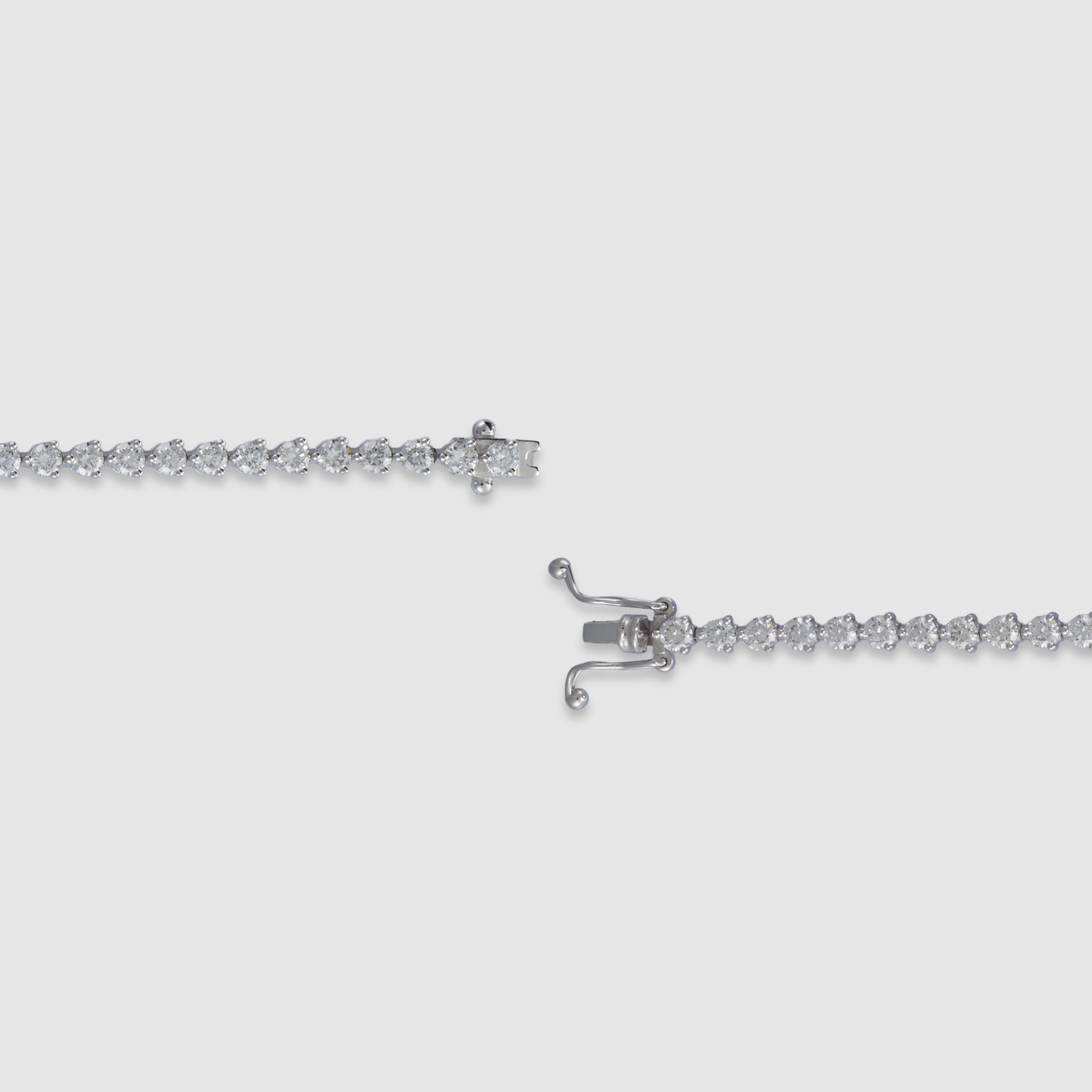 14K white gold three-prong diamond tennis bracelet