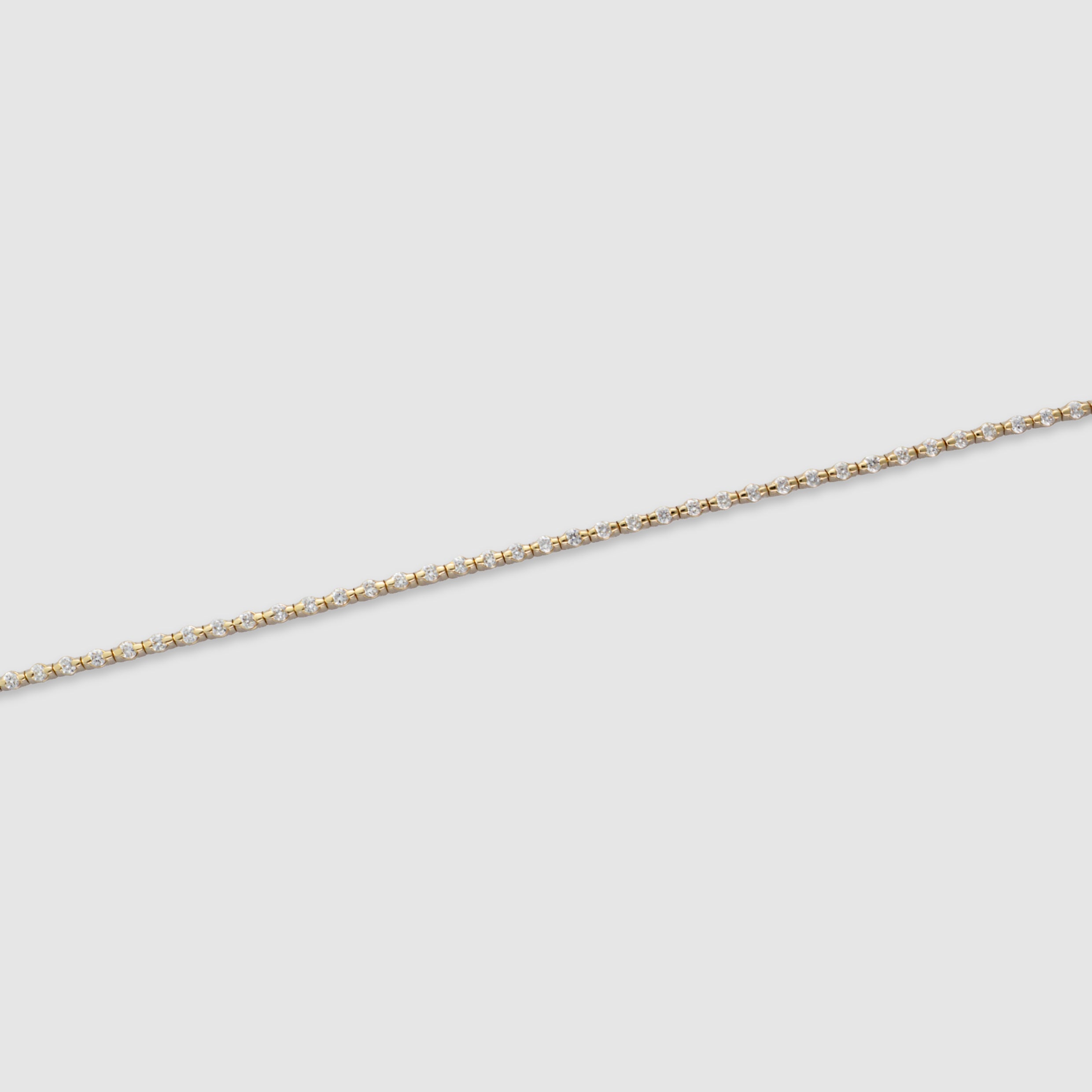 14K yellow gold round-cut diamond tennis bracelet in a bezel setting