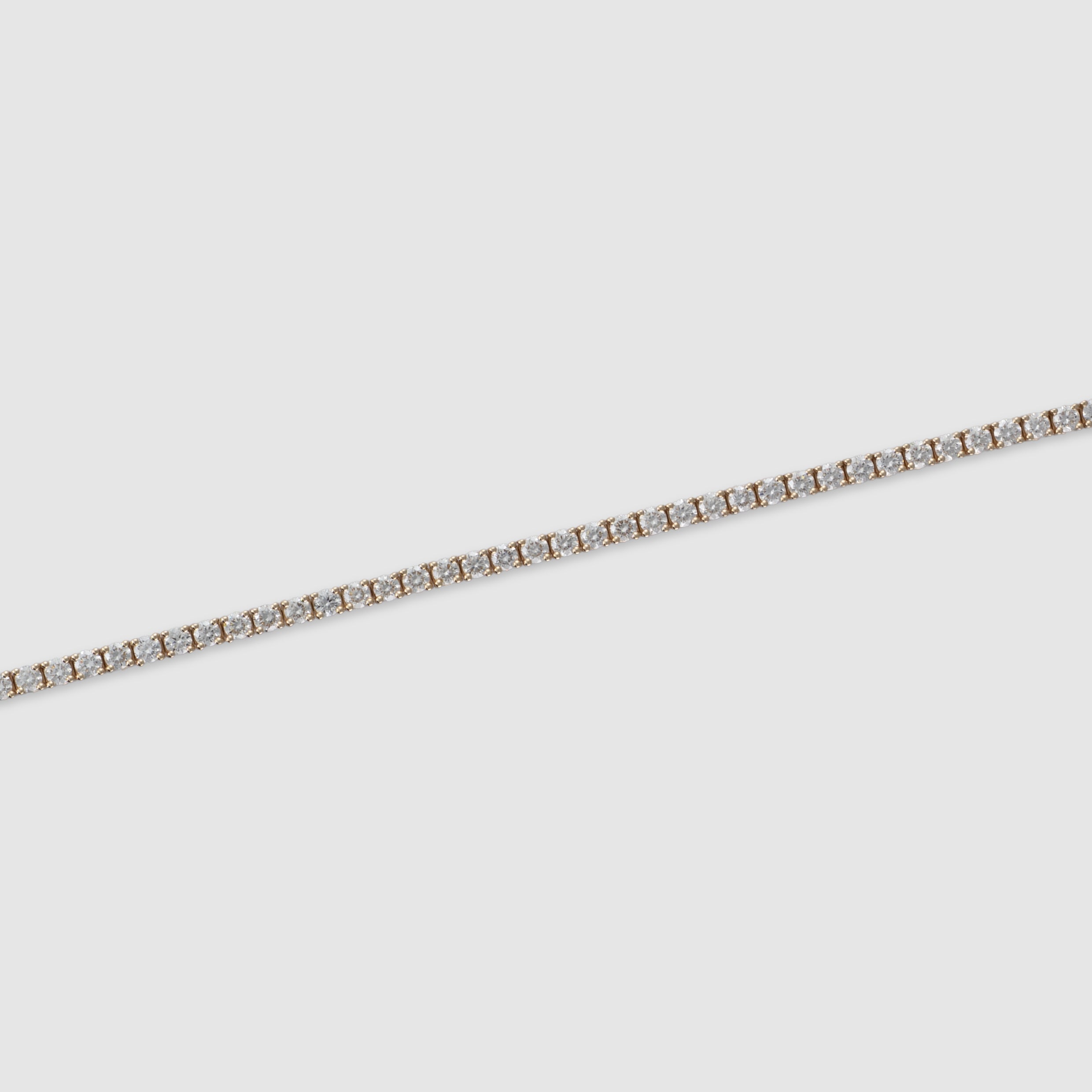 14K yellow gold four-prong diamond tennis bracelet