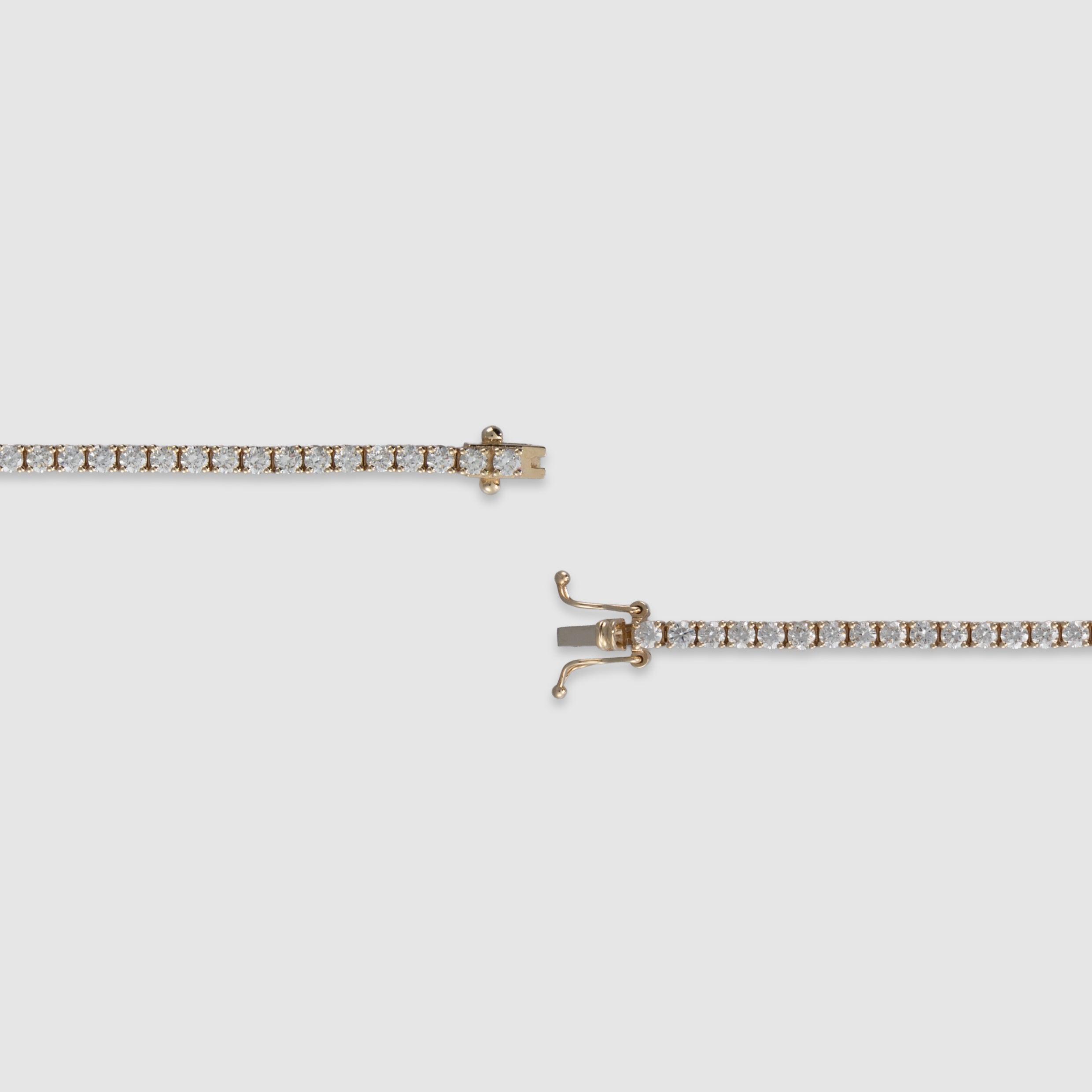 14K yellow gold four-prong diamond tennis bracelet