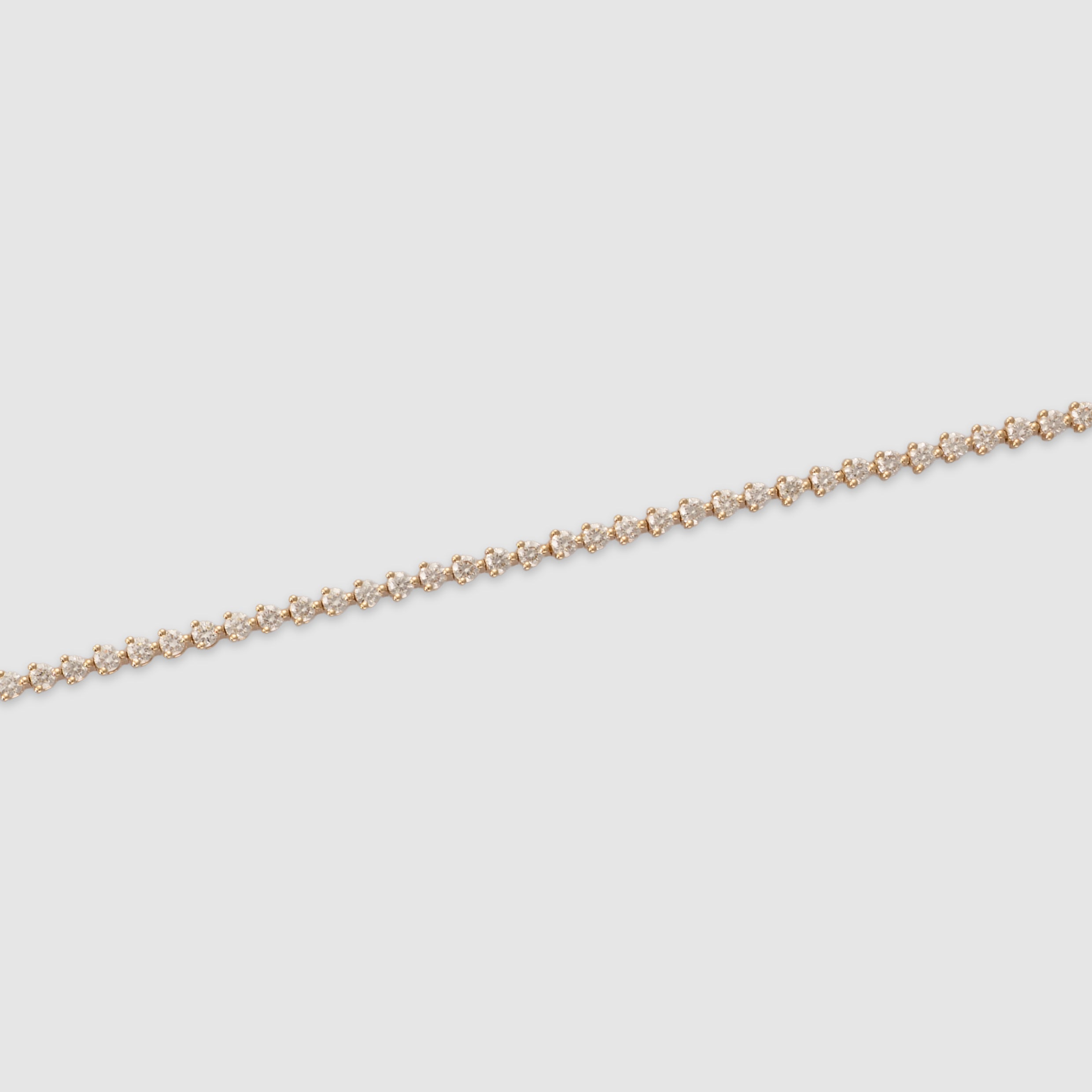 14K yellow gold three-prong diamond tennis bracelet
