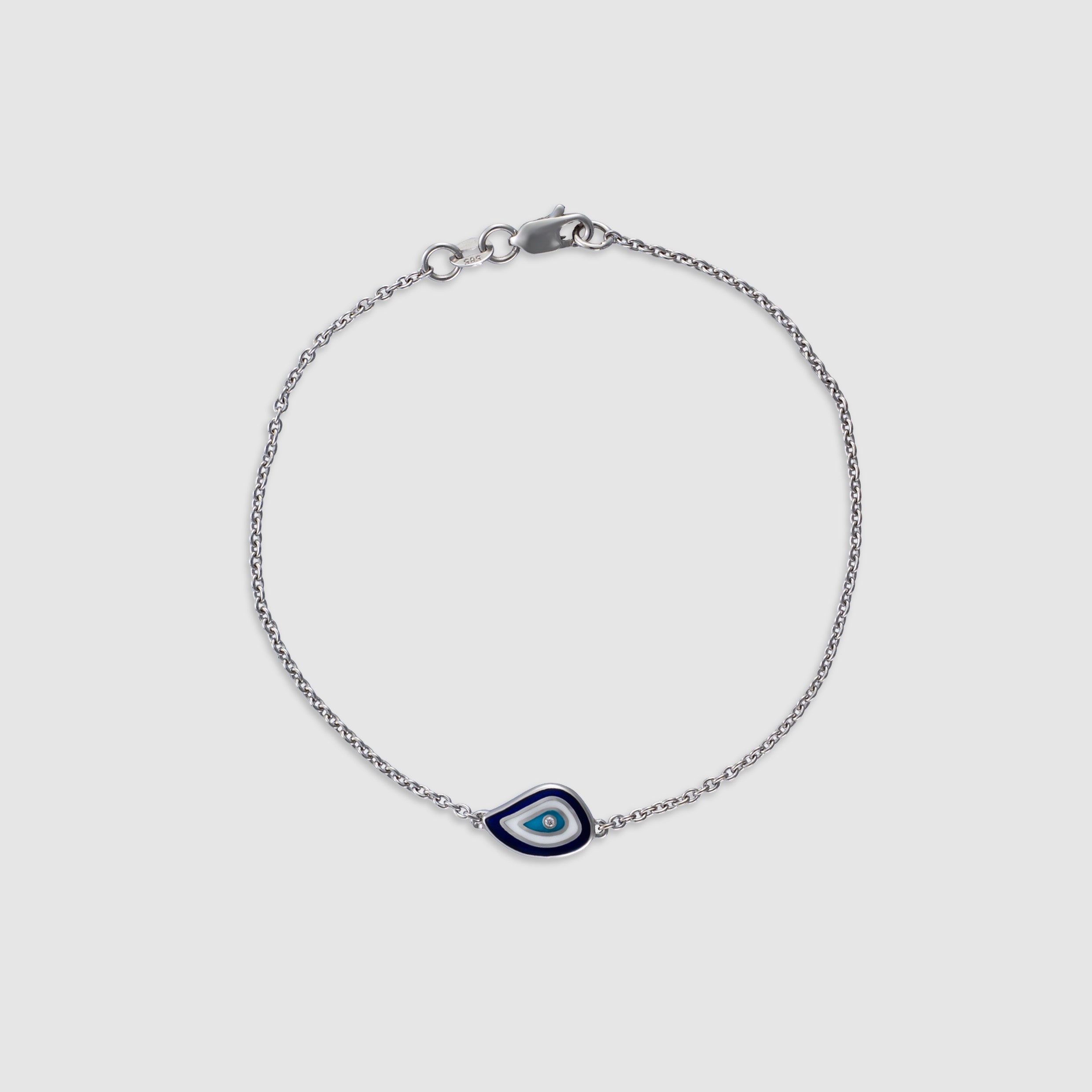 14K white gold bracelet with a diamond evil eye charm