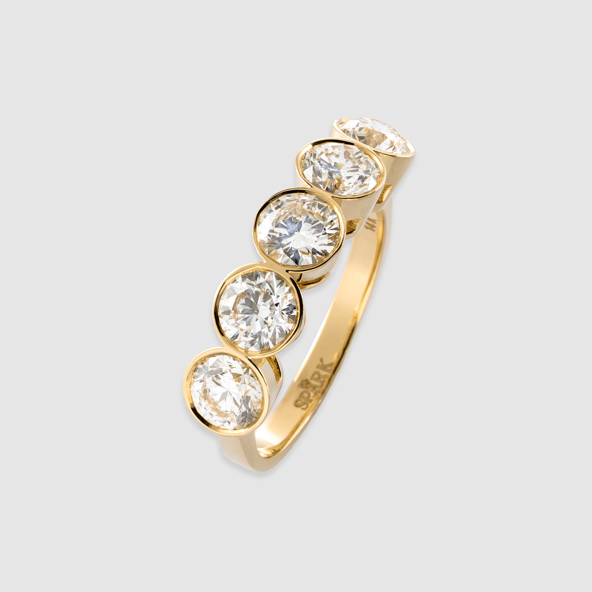 14K yellow gold five stone brilliant cut diamond in a bezel setting