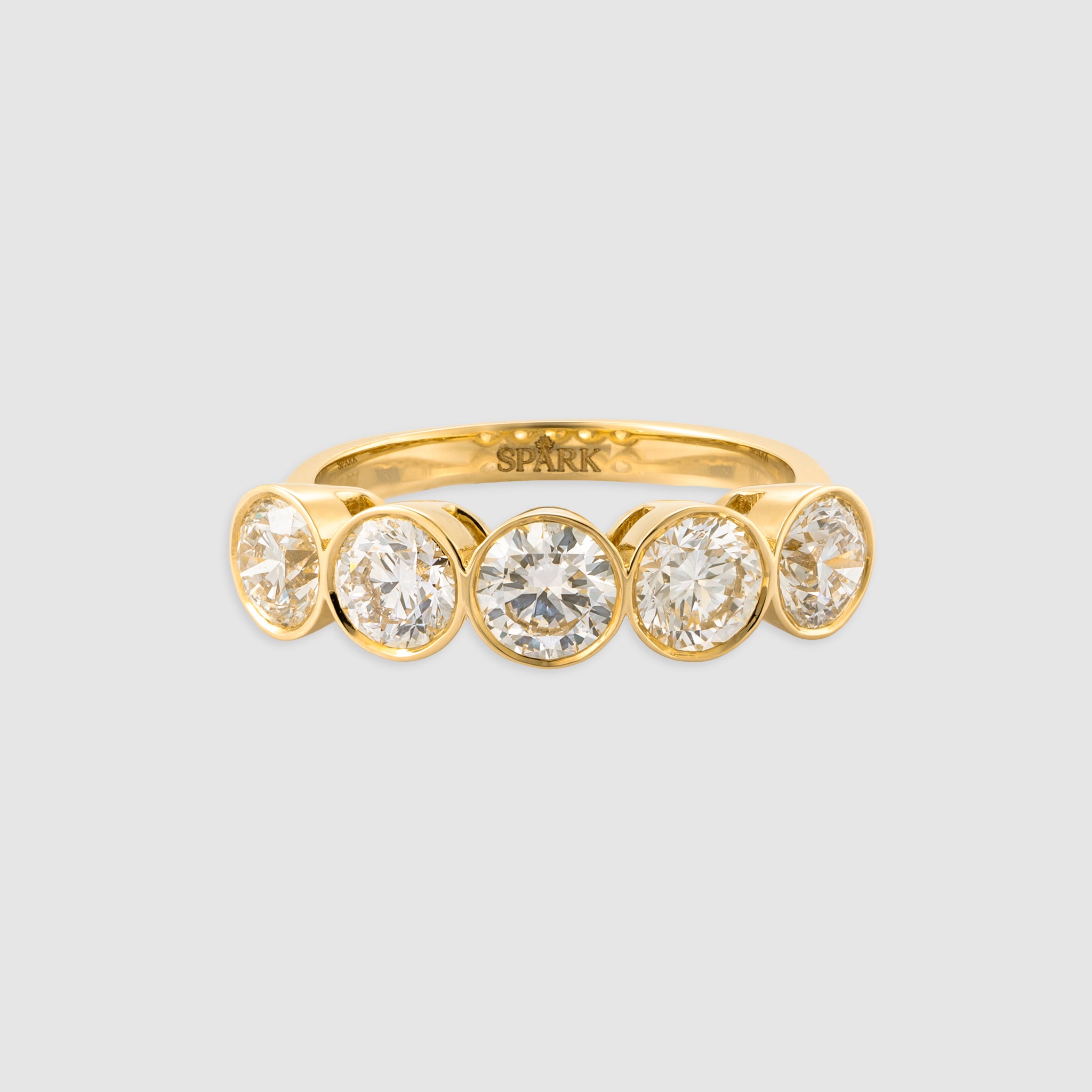 14K yellow gold five stone brilliant cut diamond in a bezel setting