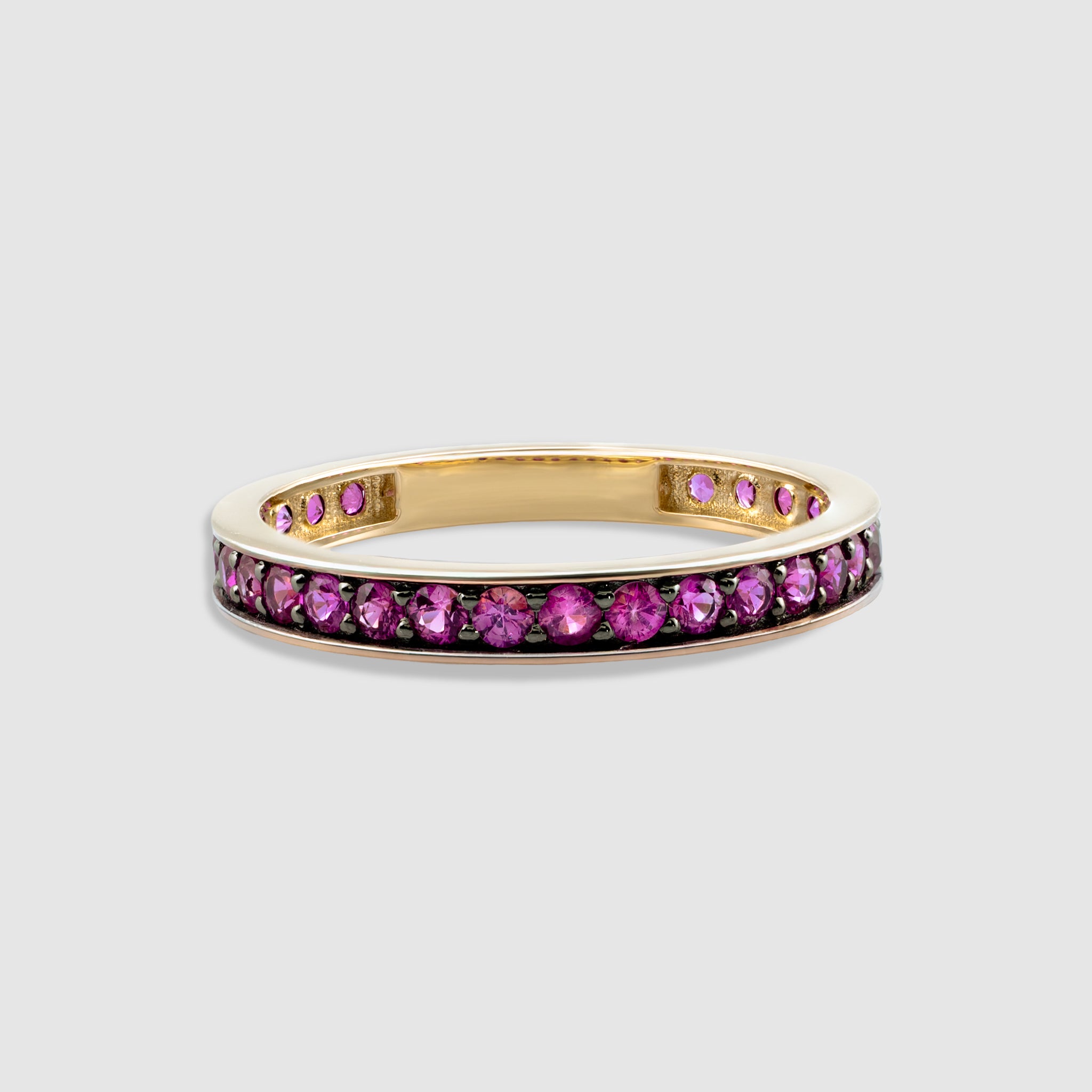 14K solid gold round cut pink sapphire eternity ring.