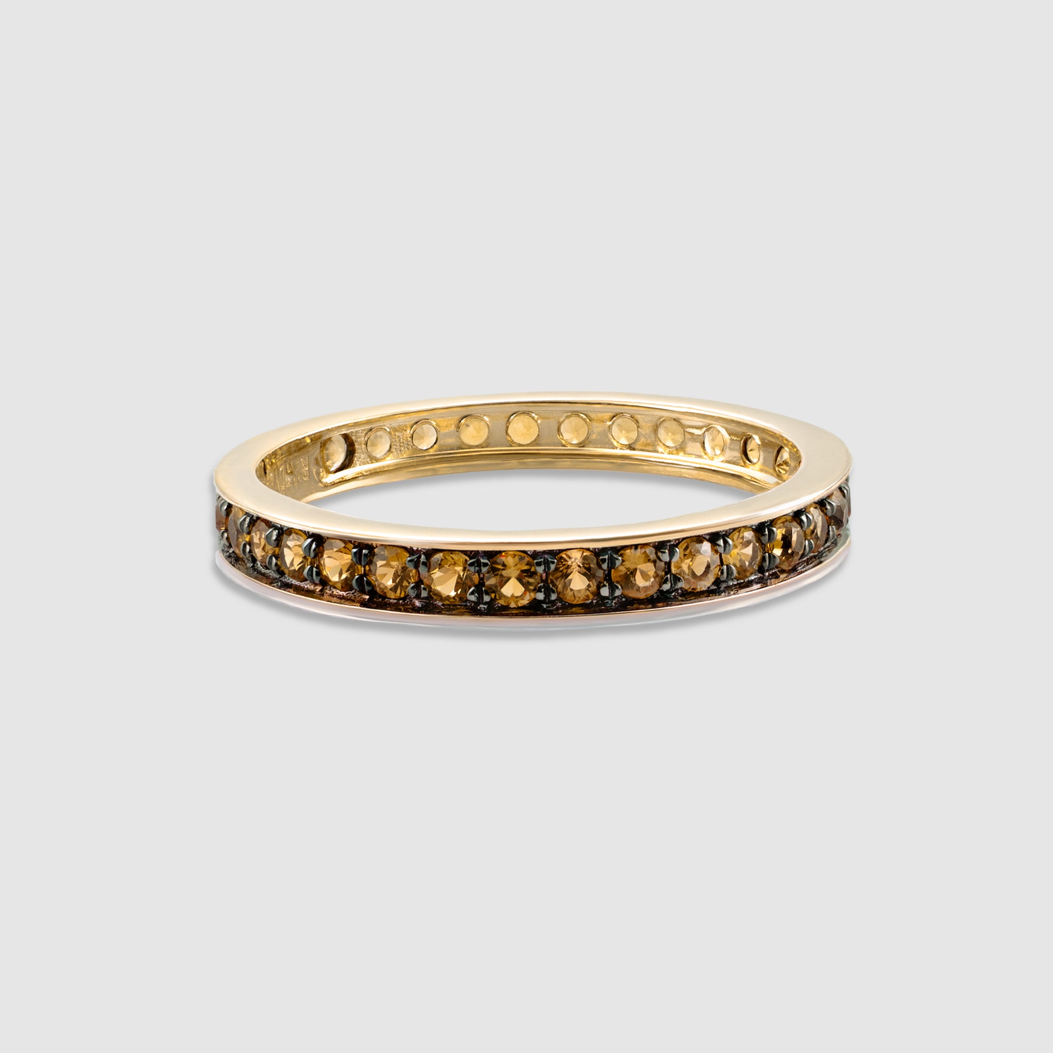 14K solid gold round cut yellow diamond eternity ring.