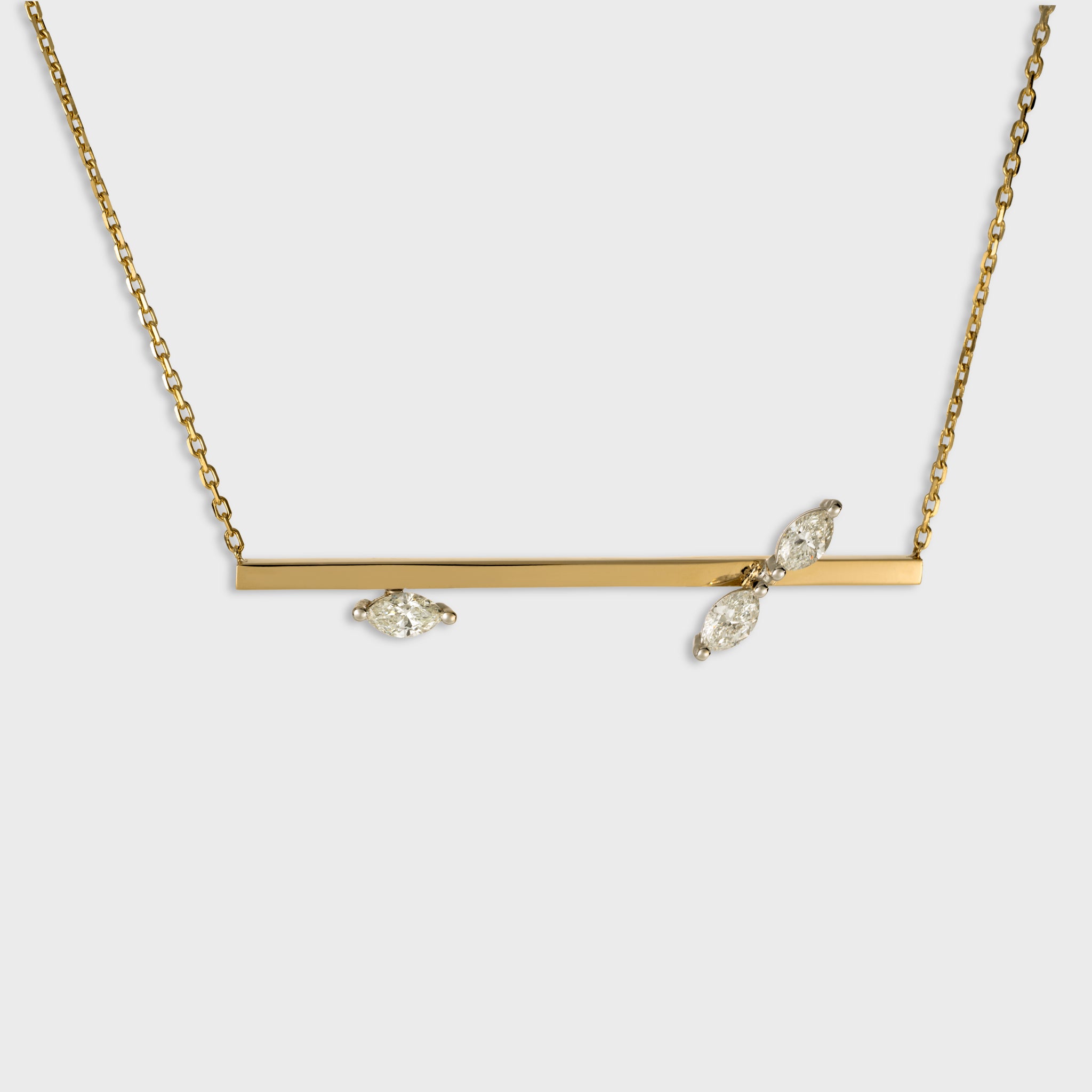 14K yellow gold horizontal bar necklace with three marquise cut diamonds