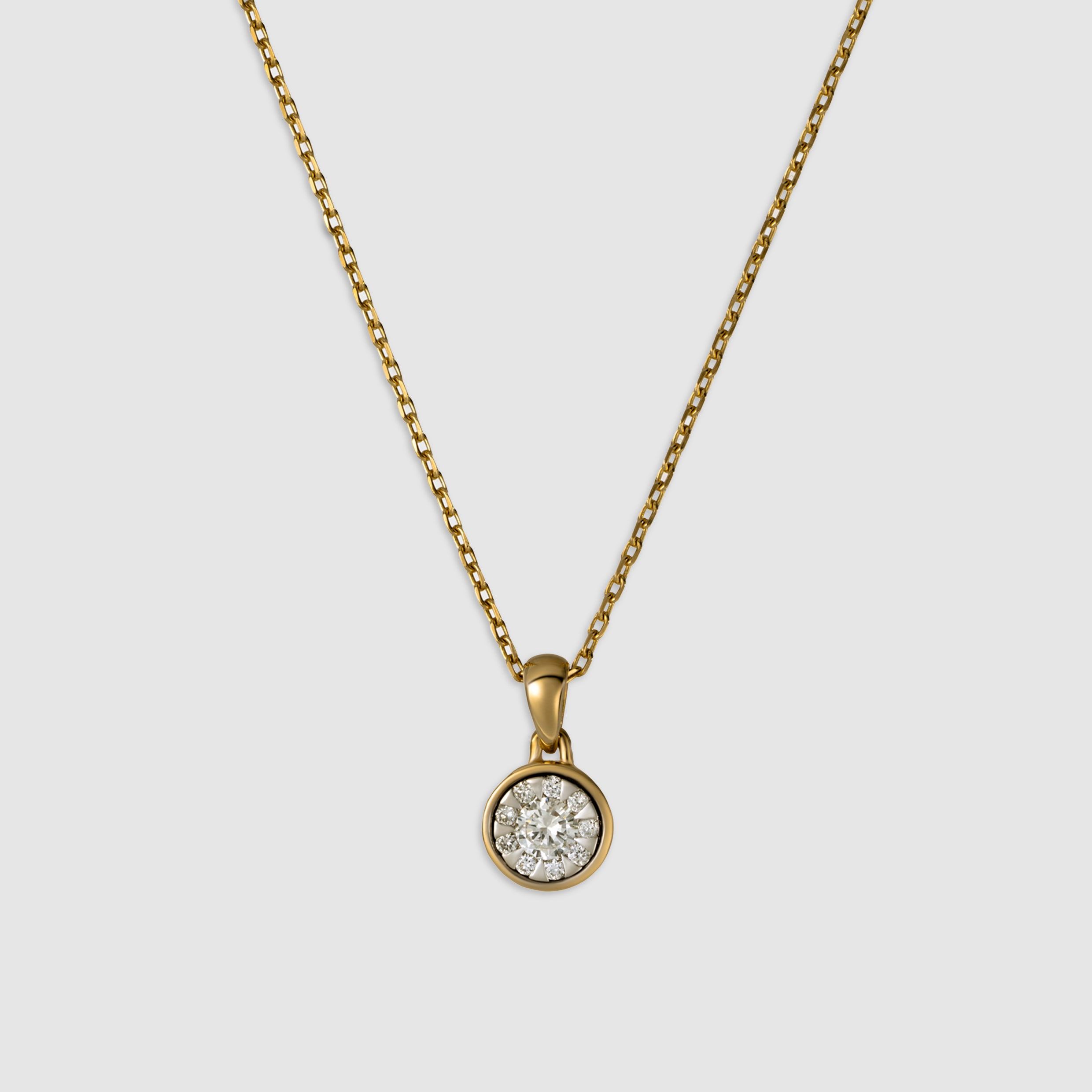 14K yellow gold round cut diamonds on a single bezel setting